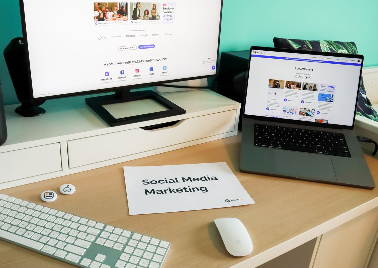 Home Stylish workspace with laptop and monitor for social media marketing.